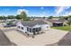 Charming home exterior with screened porch, white gravel landscaping, and convenient storage shed at 4228 Nandina St, Lake Wales, FL 33898