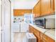 Well-organized laundry room with ample cabinet space and modern washer and dryer units at 4228 Nandina St, Lake Wales, FL 33898