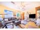 Comfortable living room with lots of windows, cozy seating, and open floor plan at 4228 Nandina St, Lake Wales, FL 33898