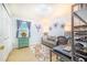 This home office features a comfortable sofa, wood floors and accent lighting at 4228 Nandina St, Lake Wales, FL 33898