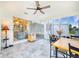 Enclosed porch featuring tile floors, fan, and an abundance of windows that fill the space with natural light at 4228 Nandina St, Lake Wales, FL 33898