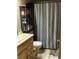 Bathroom featuring tile floors, a dark curtain rod, and a vanity at 423 Greenfield Rd, Winter Haven, FL 33884