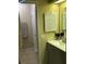 Cozy bathroom featuring a tiled floor, neutral wall colors, and a functional vanity at 423 Greenfield Rd, Winter Haven, FL 33884