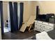 Bedroom featuring dark laminate floors, sliding glass door, and closet at 423 Greenfield Rd, Winter Haven, FL 33884