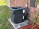 Outdoor view of the home's air conditioning unit surrounded by mulch at 423 Greenfield Rd, Winter Haven, FL 33884