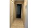 Hallway featuring tile floors and two closets at 423 Greenfield Rd, Winter Haven, FL 33884