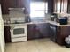 Kitchen featuring tile countertops, stainless steel appliances, and bright lighting at 423 Greenfield Rd, Winter Haven, FL 33884