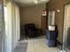 Enclosed patio featuring a ceiling fan, tile flooring, and comfortable seating area, and sliding glass doors at 423 Greenfield Rd, Winter Haven, FL 33884