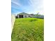 Large backyard featuring a well-kept lawn and a sturdy privacy fence at 4333 Pumice Dr, Lakeland, FL 33811