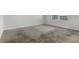 Neutrally decorated bedroom featuring carpeting and a window for natural light at 4333 Pumice Dr, Lakeland, FL 33811