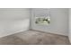 Neutral-toned bedroom with carpet and a window that brings in natural light at 4333 Pumice Dr, Lakeland, FL 33811