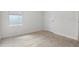 Cozy carpeted bedroom featuring a window that provides natural light and neutral walls at 4333 Pumice Dr, Lakeland, FL 33811