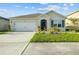 Charming single-story home featuring a well-maintained lawn and a two-car garage with driveway at 4333 Pumice Dr, Lakeland, FL 33811