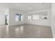 Bright living room featuring tile floors, sliding glass doors, and a large window offering ample natural light at 4333 Pumice Dr, Lakeland, FL 33811