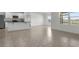 Open living space with tile flooring, seamlessly connecting the kitchen and dining areas for modern living at 4333 Pumice Dr, Lakeland, FL 33811
