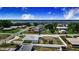 Aerial view of a home with a large fenced yard, offering privacy and space for outdoor activities, near a lake at 498 W 7Th St, Frostproof, FL 33843
