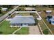 Aerial view of a well-maintained home and yard, featuring a clean layout and surrounding neighborhood at 498 W 7Th St, Frostproof, FL 33843