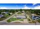 Aerial view showcasing the property's location, surrounded by lush greenery and a tranquil, residential neighborhood at 498 W 7Th St, Frostproof, FL 33843