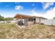 Spacious backyard featuring a covered outdoor kitchen and barbecue area perfect for entertaining at 498 W 7Th St, Frostproof, FL 33843