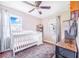 Comfortable Bedroom featuring neutral colors, and a ceiling fan at 498 W 7Th St, Frostproof, FL 33843