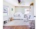 Cozy Bedroom with a white crib, chair, and ample storage at 498 W 7Th St, Frostproof, FL 33843