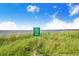 Lake Clinch public boat ramp access point with green signage on a grassy bank at 498 W 7Th St, Frostproof, FL 33843