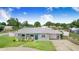 Charming single-story home with a well-manicured lawn and metal roof, exuding curb appeal at 498 W 7Th St, Frostproof, FL 33843
