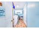 Hallway view of laundry room that includes washer, dryer, ice machine, and utility sink at 498 W 7Th St, Frostproof, FL 33843
