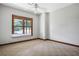 An empty bedroom with large window allows natural light and outdoor view, perfect for relaxation and rest at 553 Thornburg Rd, Babson Park, FL 33827