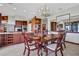 Formal dining room with elegant chandelier, perfect for Gathering gatherings and entertaining at 553 Thornburg Rd, Babson Park, FL 33827