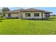 Home exterior with manicured lawn, features a well-maintained yard at 553 Thornburg Rd, Babson Park, FL 33827