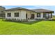 Home exterior with manicured lawn and well-maintained landscaping at 553 Thornburg Rd, Babson Park, FL 33827