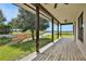 View from the porch to the canal, lined with trees, and the lake in the distance at 553 Thornburg Rd, Babson Park, FL 33827