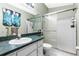 Bathroom with a glass shower door and countertop at 59 Saint Kitts Cir, Winter Haven, FL 33884