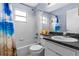 Bathroom with shower-tub combo and beach-themed decor at 59 Saint Kitts Cir, Winter Haven, FL 33884