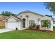 Attractive one-story home featuring a two-car garage, tidy landscaping, and a bright, welcoming entrance at 59 Saint Kitts Cir, Winter Haven, FL 33884