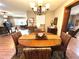 Dining area with a chandelier and natural light, features seamless access to other rooms at 605 Wanamaker Ave, Fort Meade, FL 33841