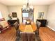 Dining room area featuring a decorative chandelier and view to other rooms at 605 Wanamaker Ave, Fort Meade, FL 33841