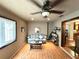 A secondary sitting area features lots of light, hardwood floors, and easy access to other rooms at 605 Wanamaker Ave, Fort Meade, FL 33841