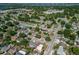 Aerial view of neighborhood featuring tree-lined streets and Gathering homes at 608 William Ave, Winter Haven, FL 33880