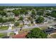 Aerial view of neighborhood with mature trees and single Gathering homes at 608 William Ave, Winter Haven, FL 33880