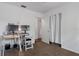 Bedroom with a desk, multiple computer monitors, and closet at 608 William Ave, Winter Haven, FL 33880