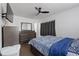 Comfortable bedroom with ceiling fan, TV, large dresser and good natural light at 608 William Ave, Winter Haven, FL 33880