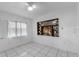 Bright bedroom featuring a custom display case and a large window at 608 William Ave, Winter Haven, FL 33880
