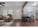 Open dining area with a stylish table and seating near the living room at 608 William Ave, Winter Haven, FL 33880