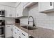 Kitchen featuring granite countertops and a black, gooseneck faucet at 608 William Ave, Winter Haven, FL 33880