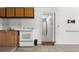 Kitchen featuring tile flooring and white appliances at 608 William Ave, Winter Haven, FL 33880