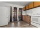 Cozy kitchen featuring tile flooring and access to the backyard through French doors at 608 William Ave, Winter Haven, FL 33880