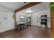 Open kitchen with an adjacent dining area, stainless steel appliances, and light cabinetry at 608 William Ave, Winter Haven, FL 33880
