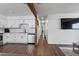 Open floorplan view of updated kitchen, hallway, and living area at 608 William Ave, Winter Haven, FL 33880